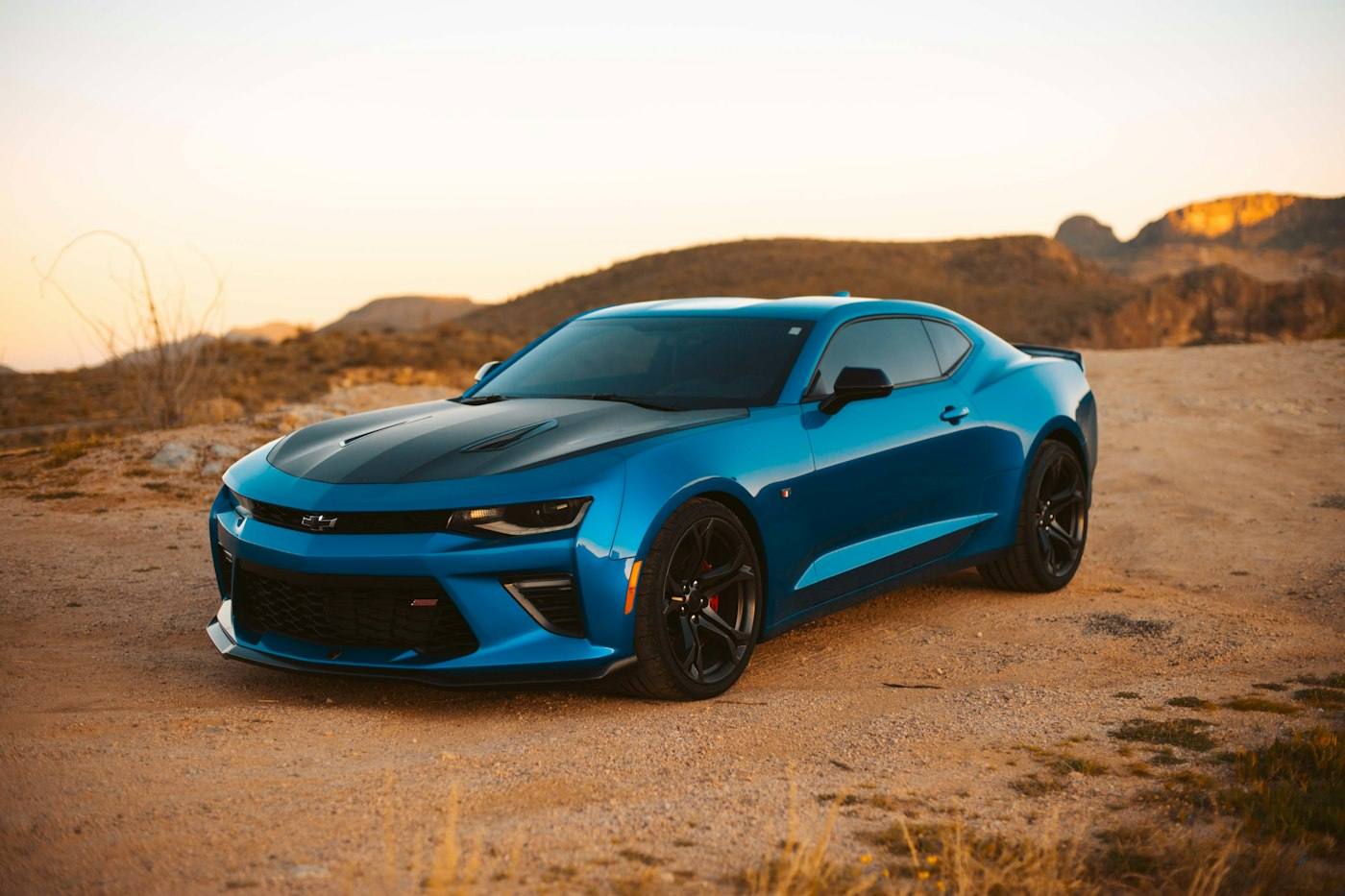 Modified performance car at sunset — representative visual of custom attitude builds